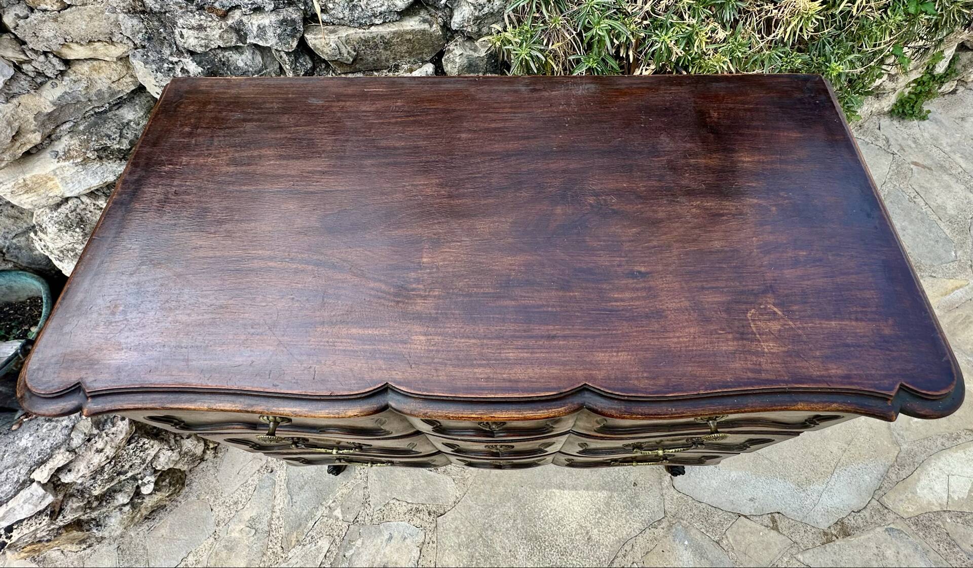 Carved and moulded solid wood commode in the Louis XV style.