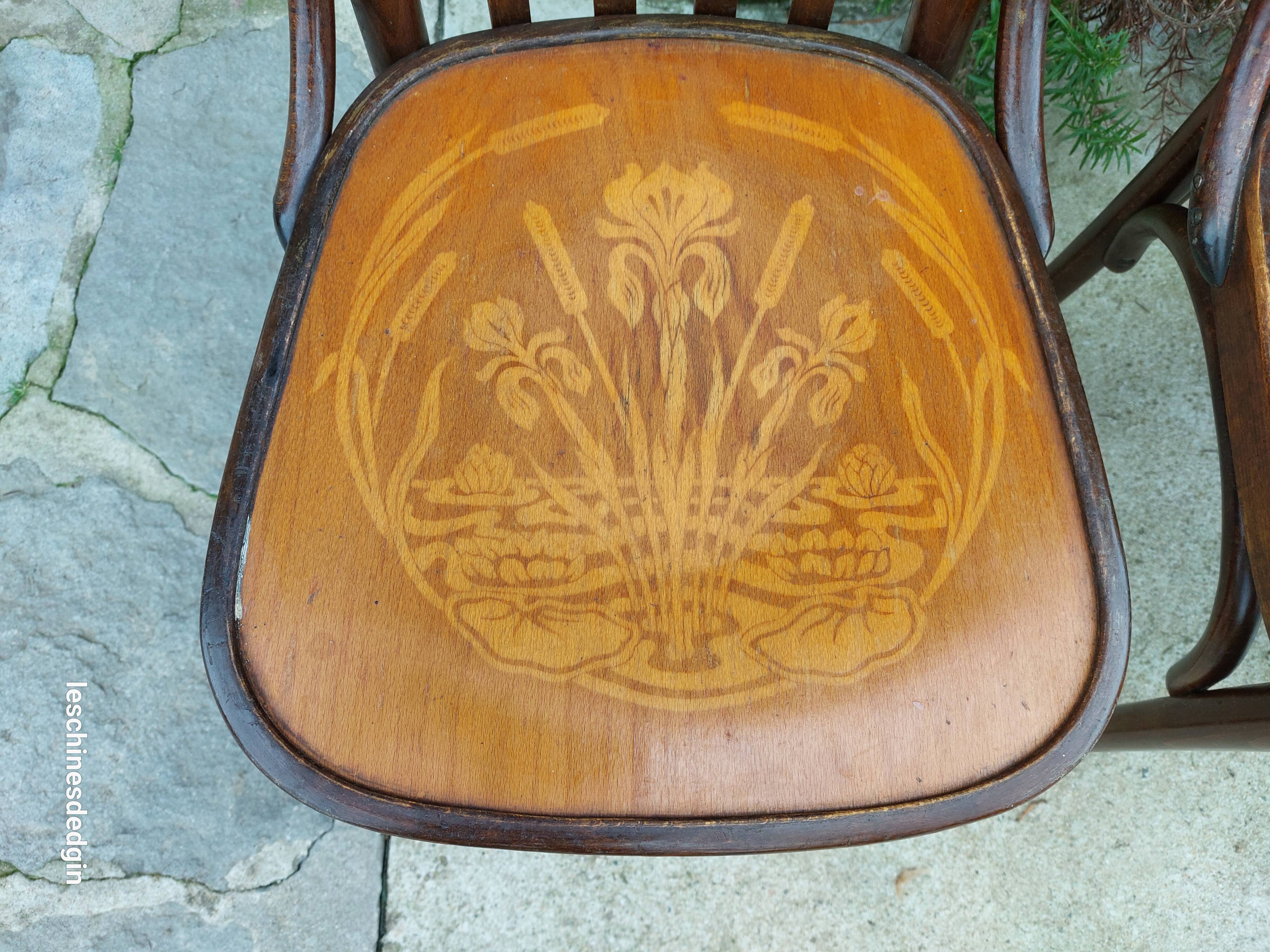 4 bentwood bistro chairs with a pattern on the seat