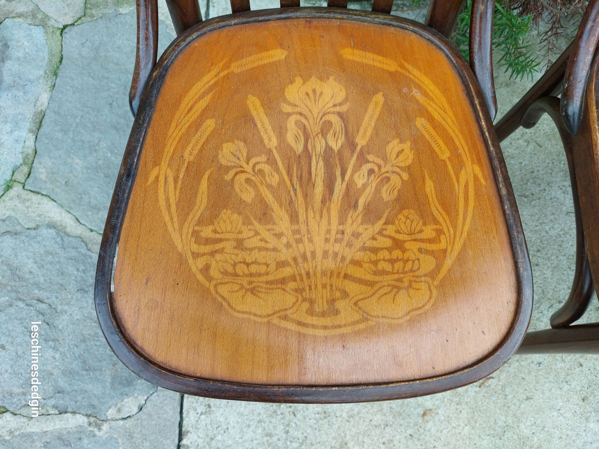 4 bentwood bistro chairs with a pattern on the seat