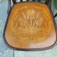 4 bentwood bistro chairs with a pattern on the seat