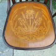 4 bentwood bistro chairs with a pattern on the seat