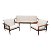 Living room, three-seater sofa and two armchairs, modernist in teak, France around 1950.