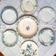 Old mismatched dinner plates accompanied by a dish