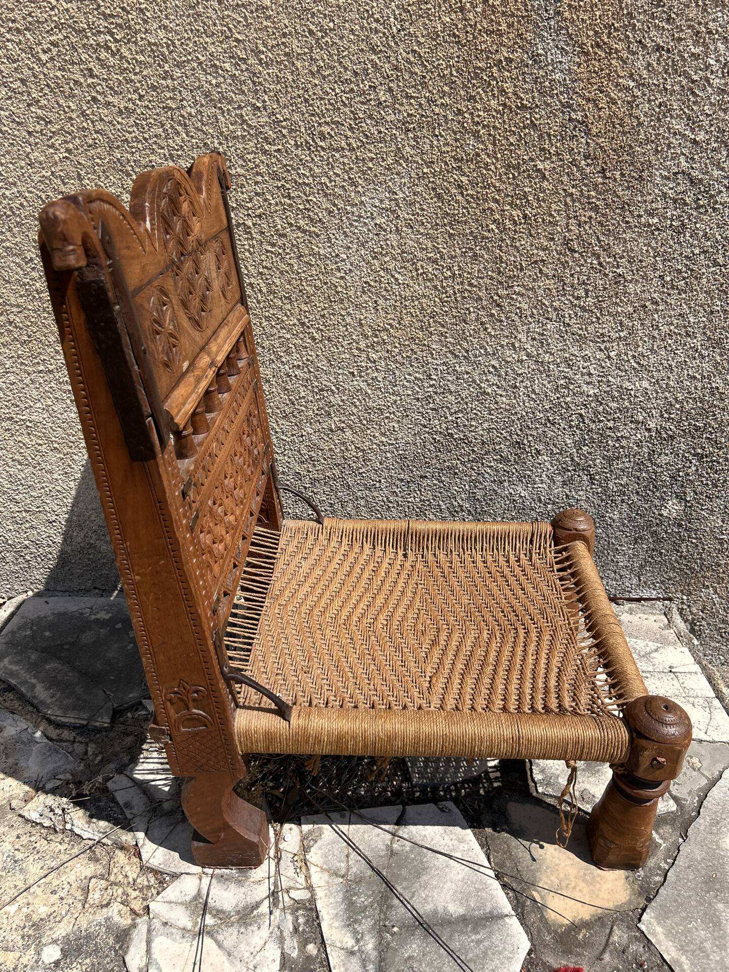 Antique ethnic chair in carved wood