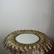 Large Italian sunburst wall mirror in gilded metal, 1960s-70s.