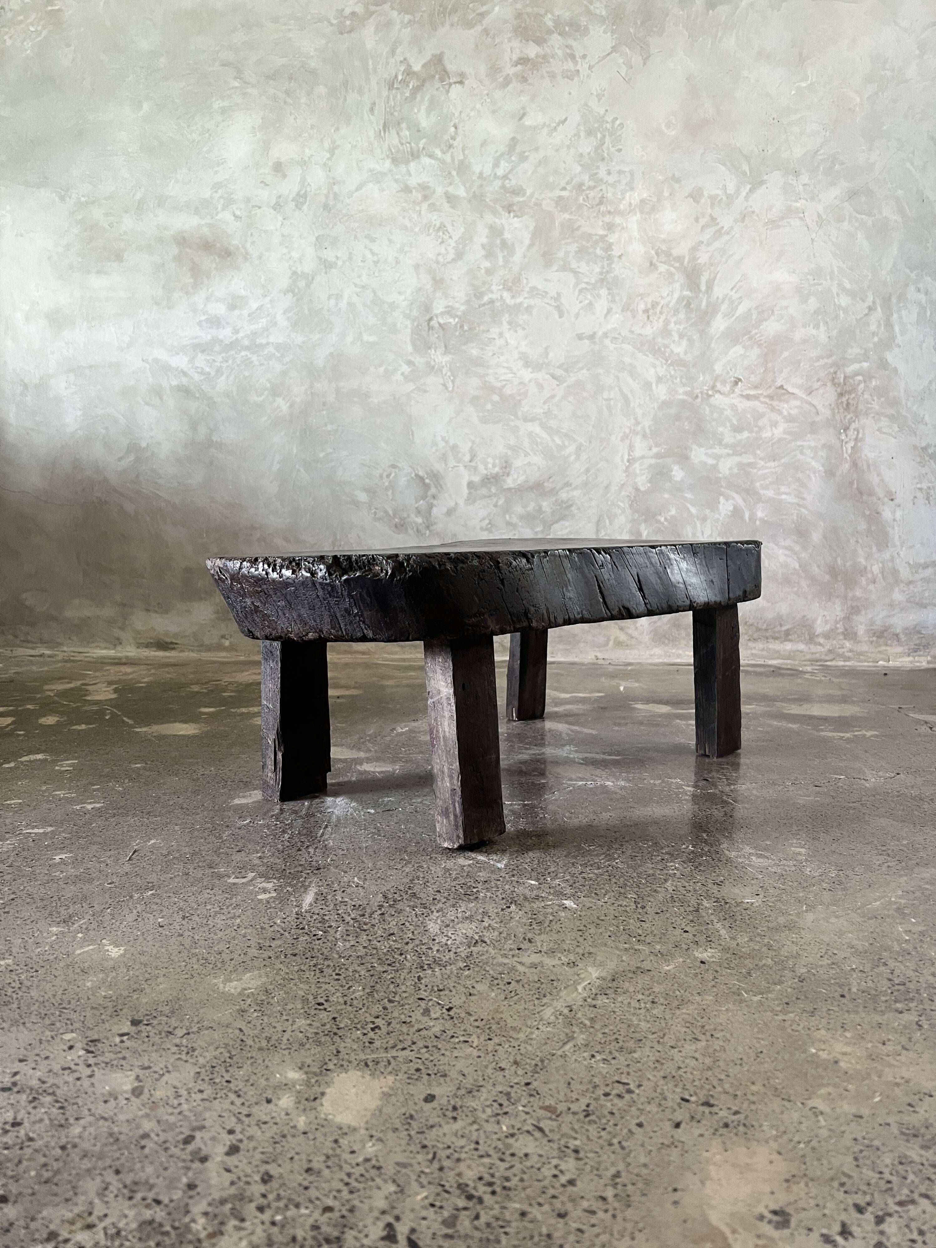 Small old Asian wooden coffee table in Japanese style, kidney-shaped top