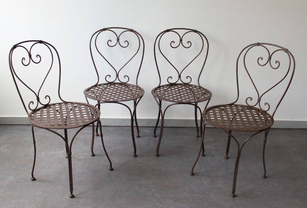 Set of 4 wrought iron chairs.