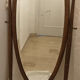 Old large psychic mirror on wooden stand