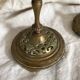 Pair of openwork brass candlesticks and glass bobeches