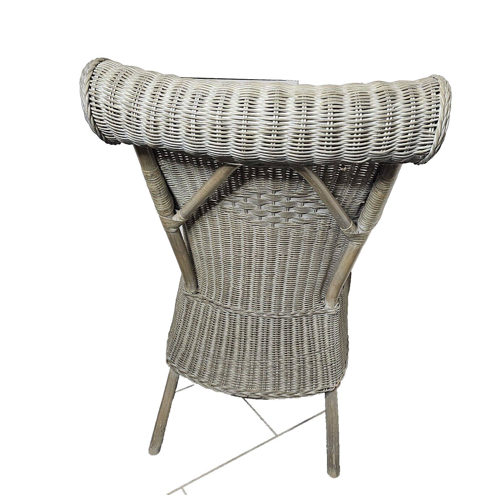 Gray patinated rattan armchair