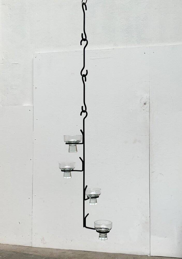 Mid-century metal and glass pendant light from the 1960s.