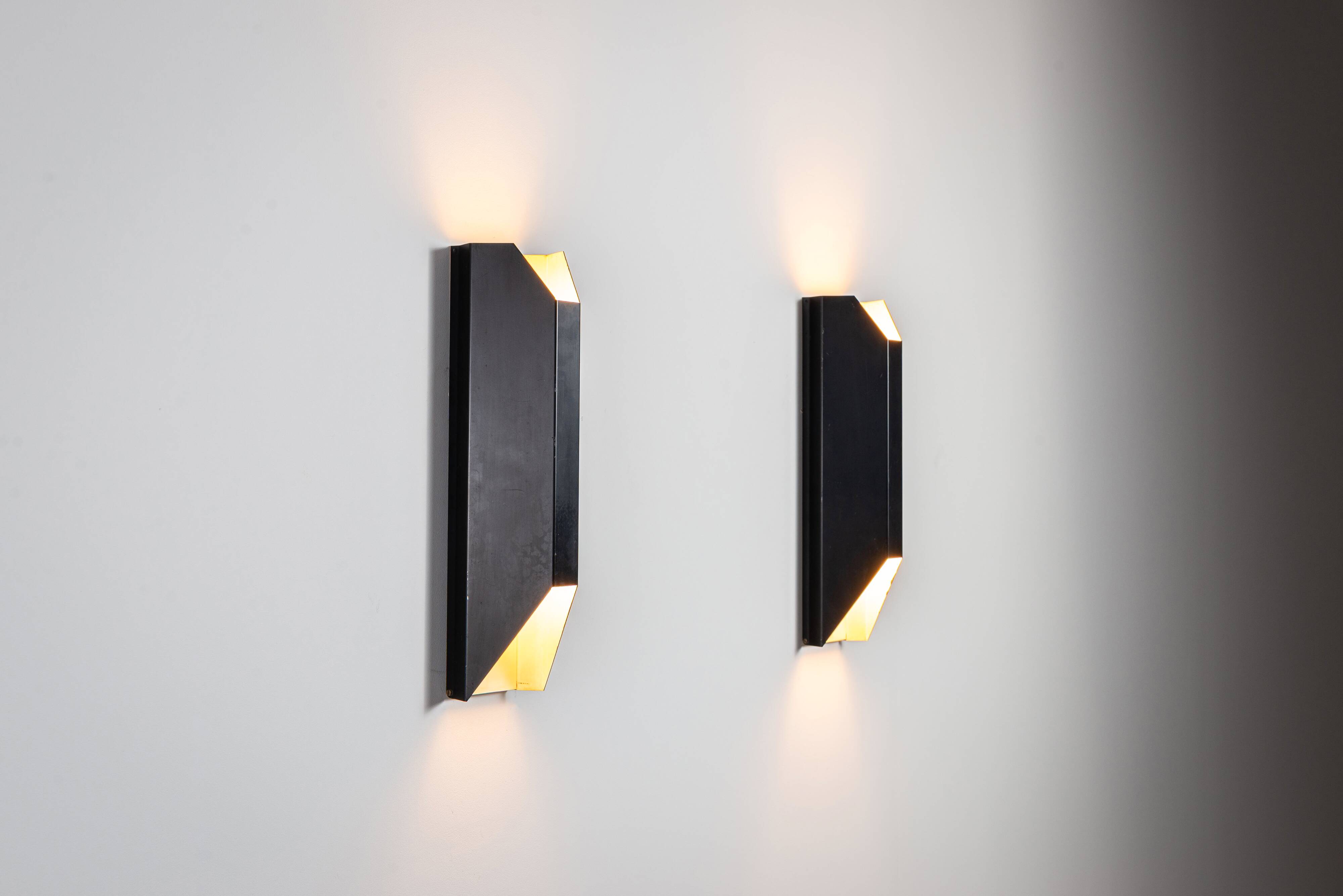 Architectural pair of vintage black metal wall lamps with angular geometric