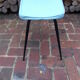 Vintage stool with tapered legs in sky blue faux leather.