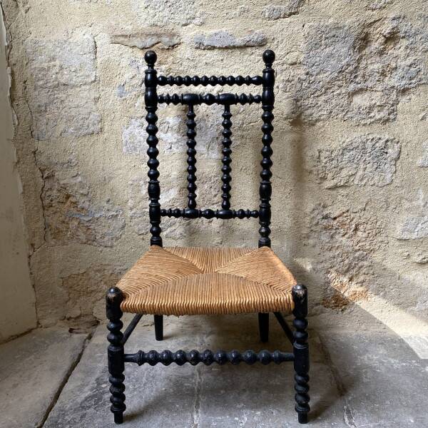 Low chair in turned wood