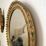Oval Florentine mirror in powder pink and gold wood, 1960s.
