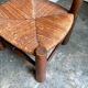 Low brutalist chair in dark wood and straw no. 2