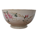 Old opaque porcelain bowl from Gien with a floral decoration.