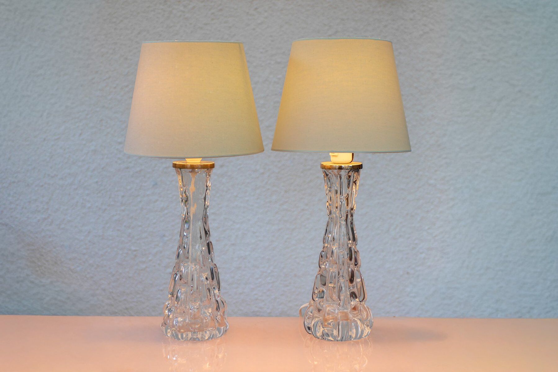 Crystal glass table lamps by Carl Fagerlund for Orrefors, Sweden.