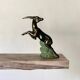 Art deco bookends in pink marble and spelters, antelopes