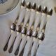 12 small silver-plated metal spoons by Guildart