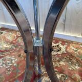 Contemporary glass and chrome dining table.