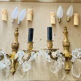 Pair of gilt bronze wall sconces with pendants from the mid-20th century.