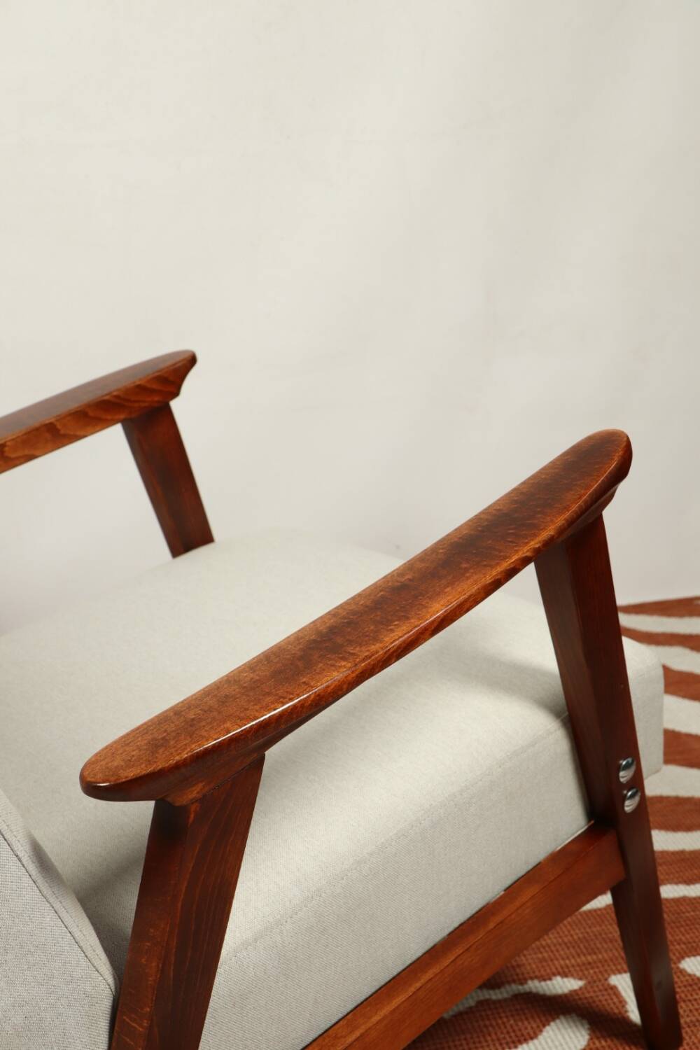 Vintage light gray armchair dark wood Scandinavian design 1970