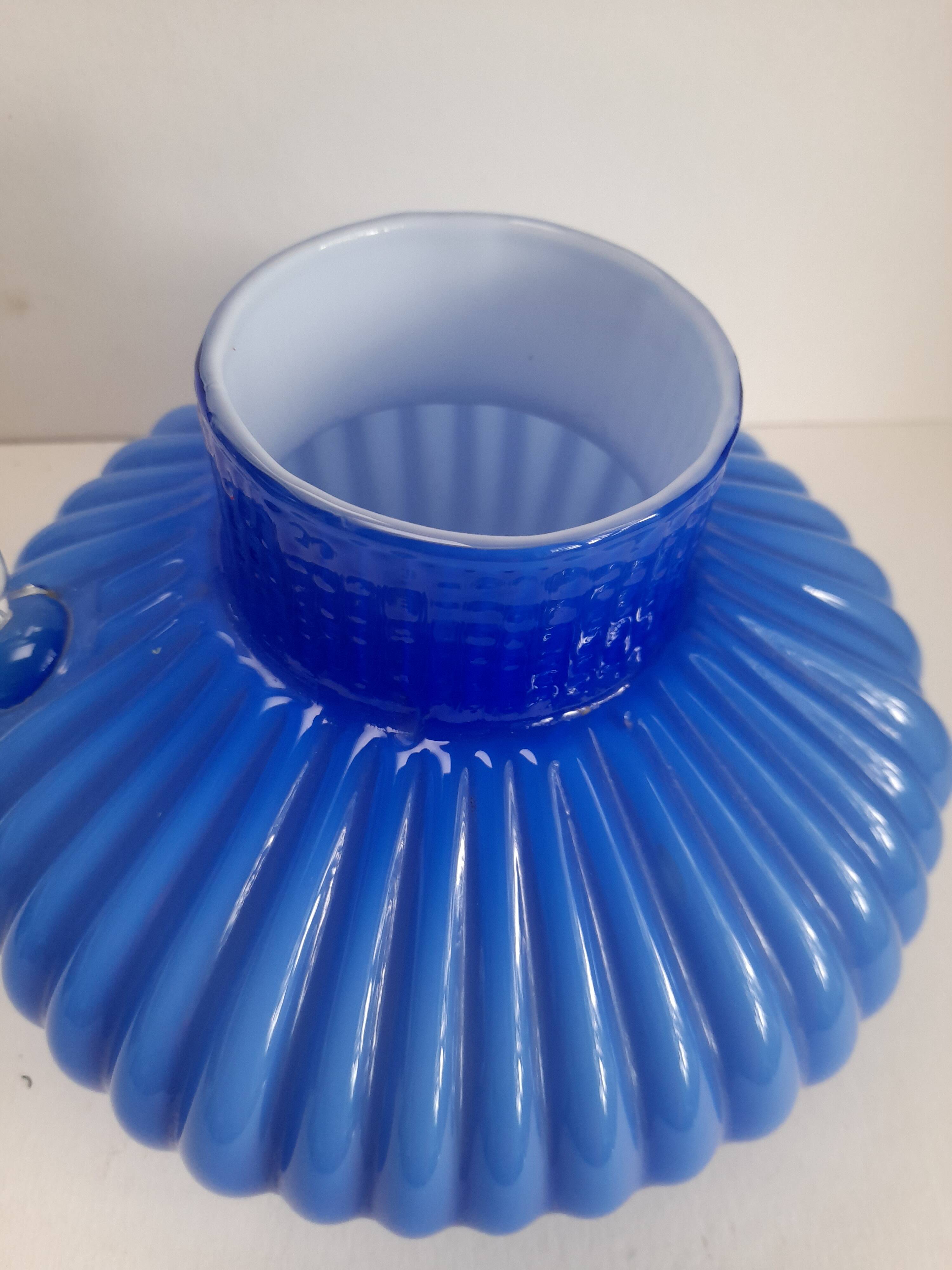 Blue opaline vase with a round handle