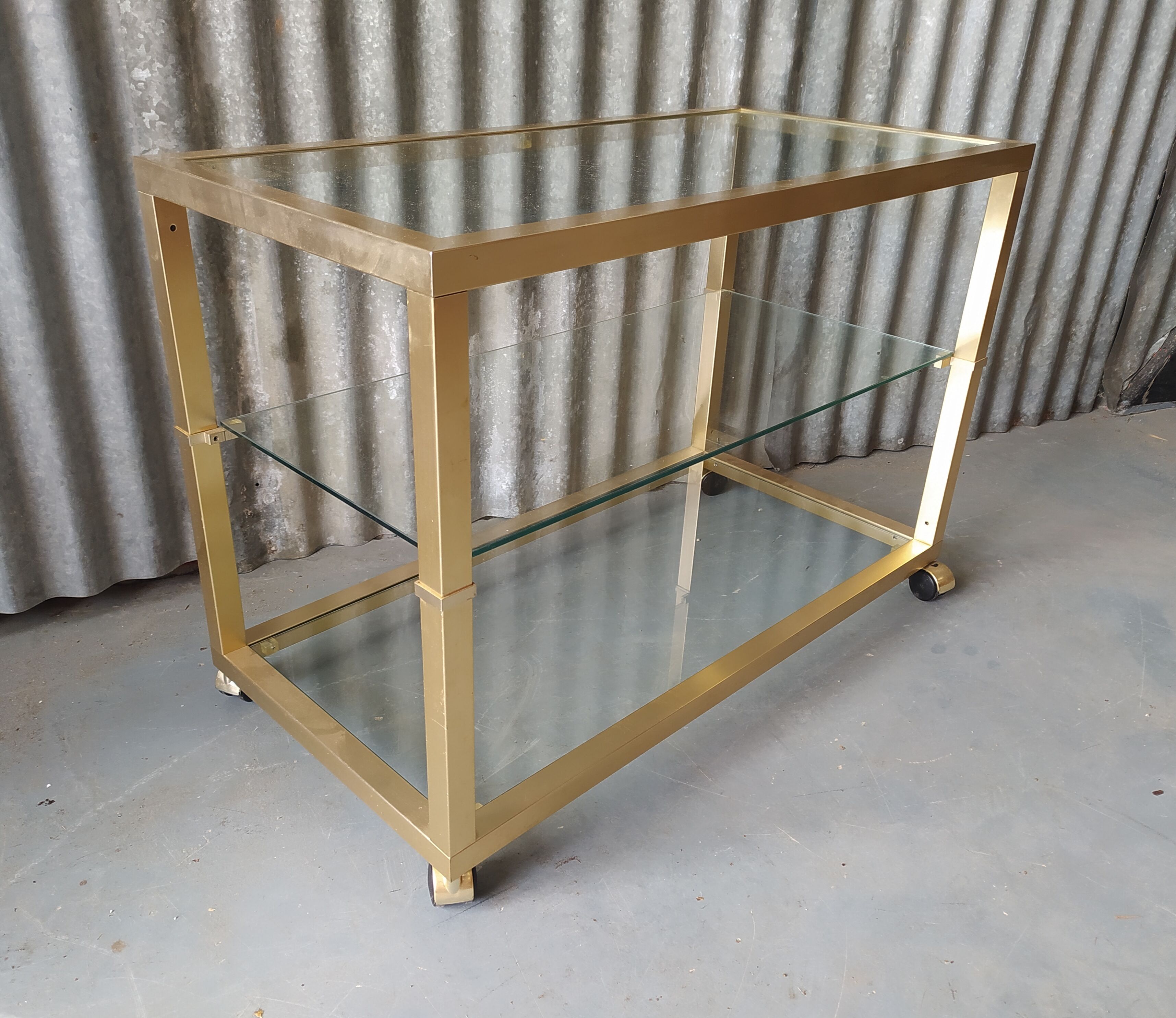 Table basse vintage metal doré et verre