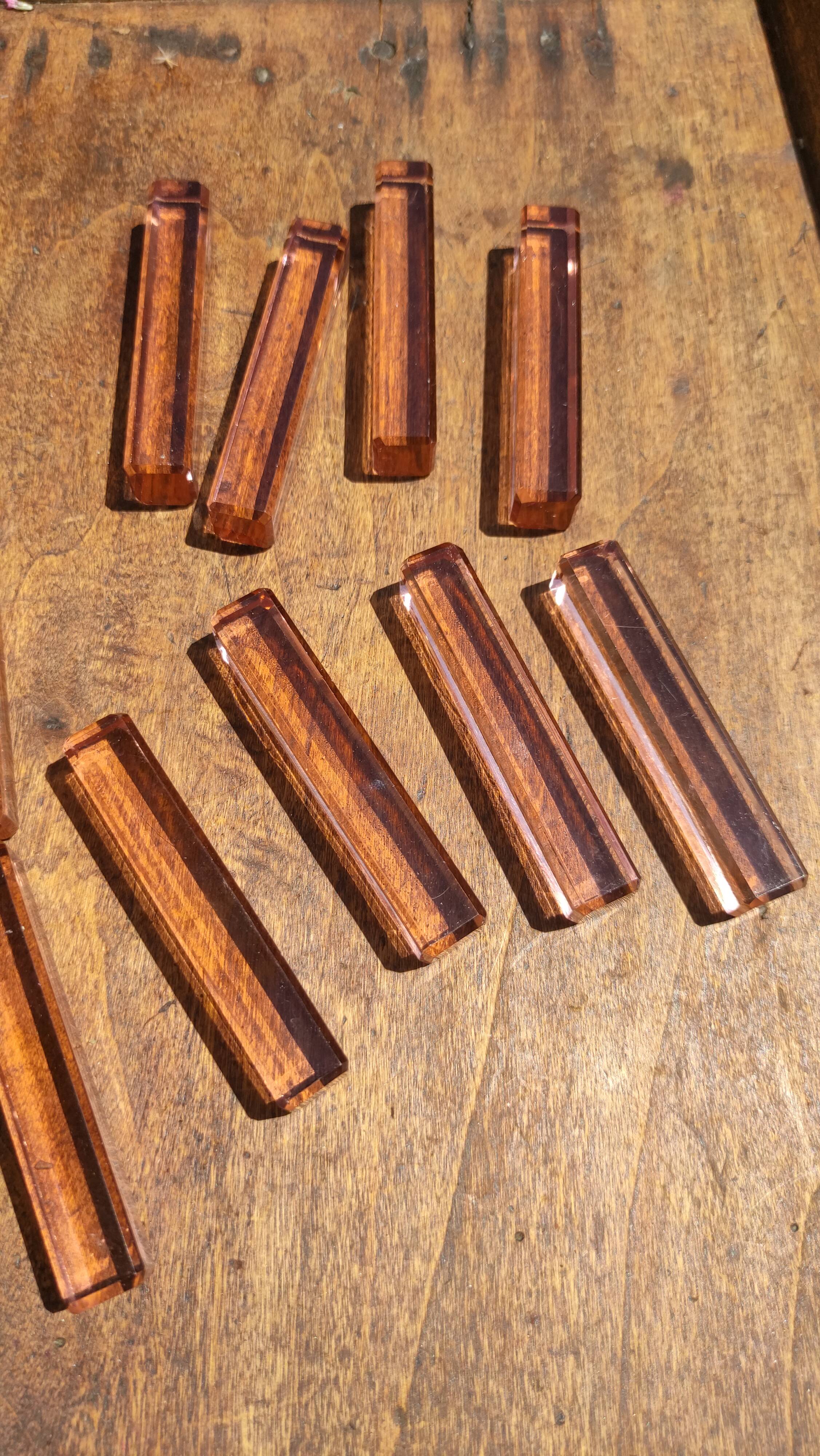 Ten pink glass knife holders