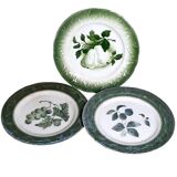 Antique earthenware plates with fruit decoration.