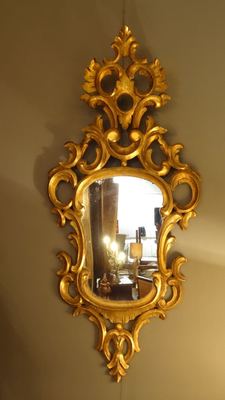 Carved and gilded wooden mirror with gold leaf 46 x 103 cm