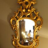 Carved and gilded wooden mirror with gold leaf 46 x 103 cm