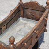 Antique cradle planter