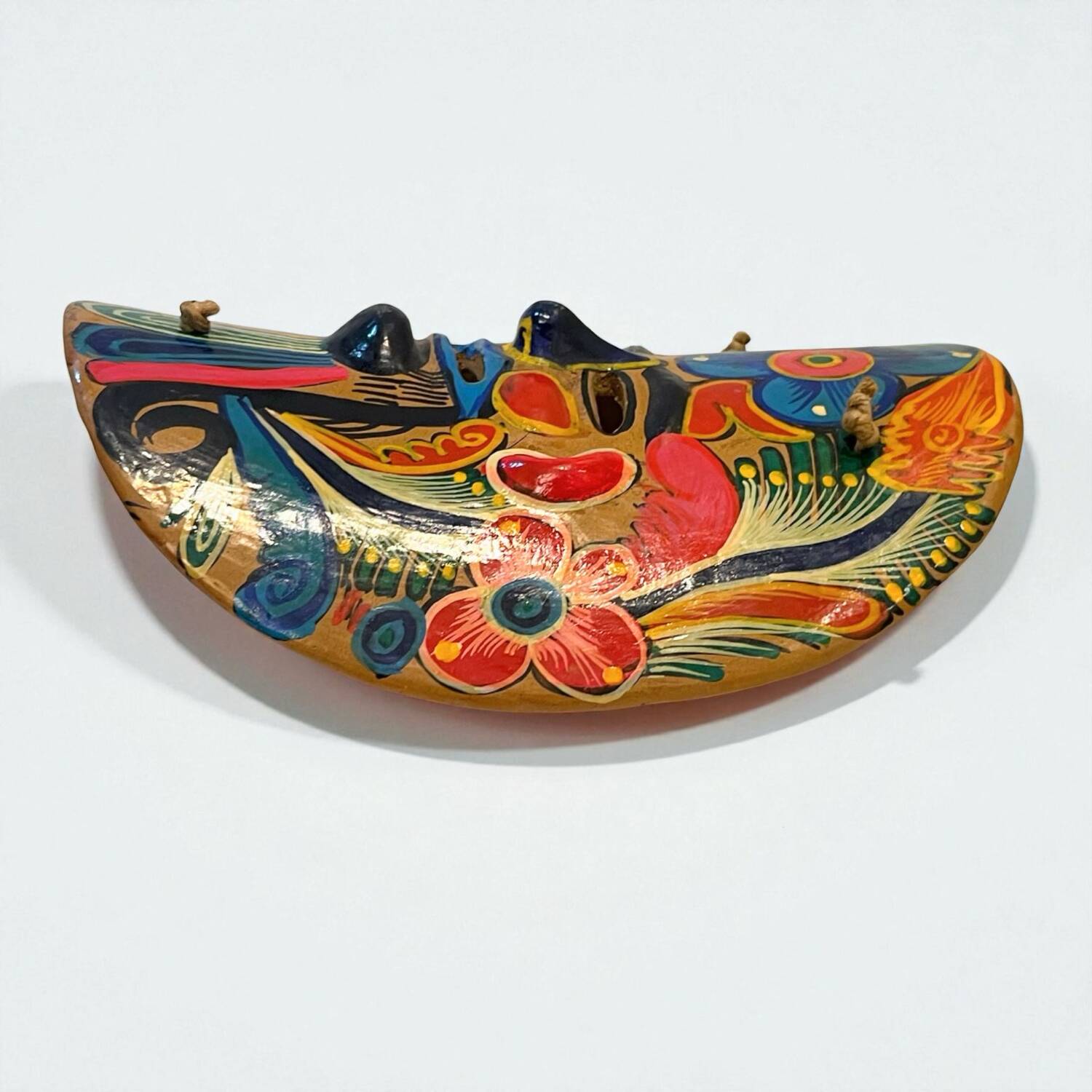 Mexican folk art mask in colored terracotta, 1970s