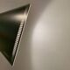 Cone pendant produced by Danish Lyfa in beautiful black lacquer with perforated shade and brass top.