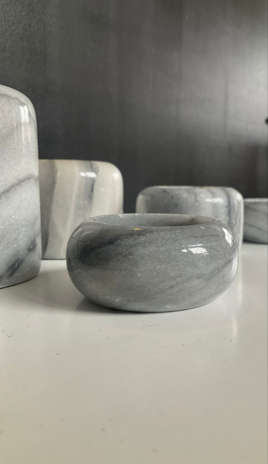 Set of 5 nesting candle holders in white marble.