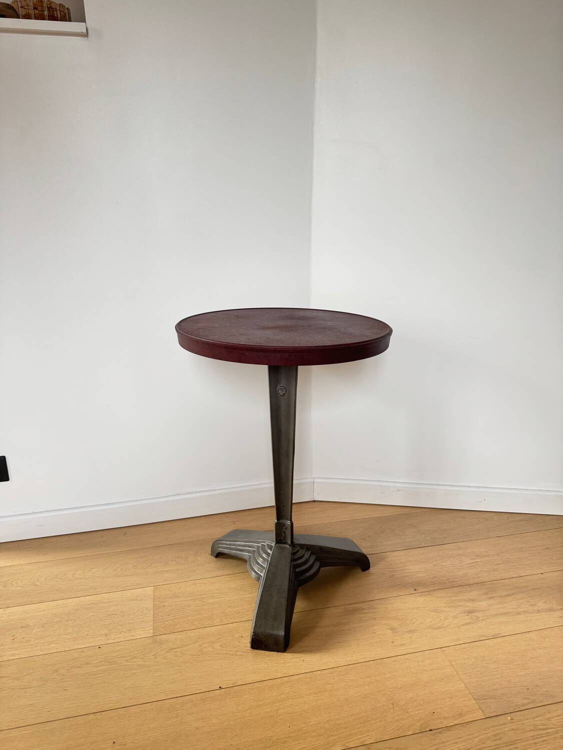 Rare Louis Vuitton cast iron bistro table with a bakelite top.