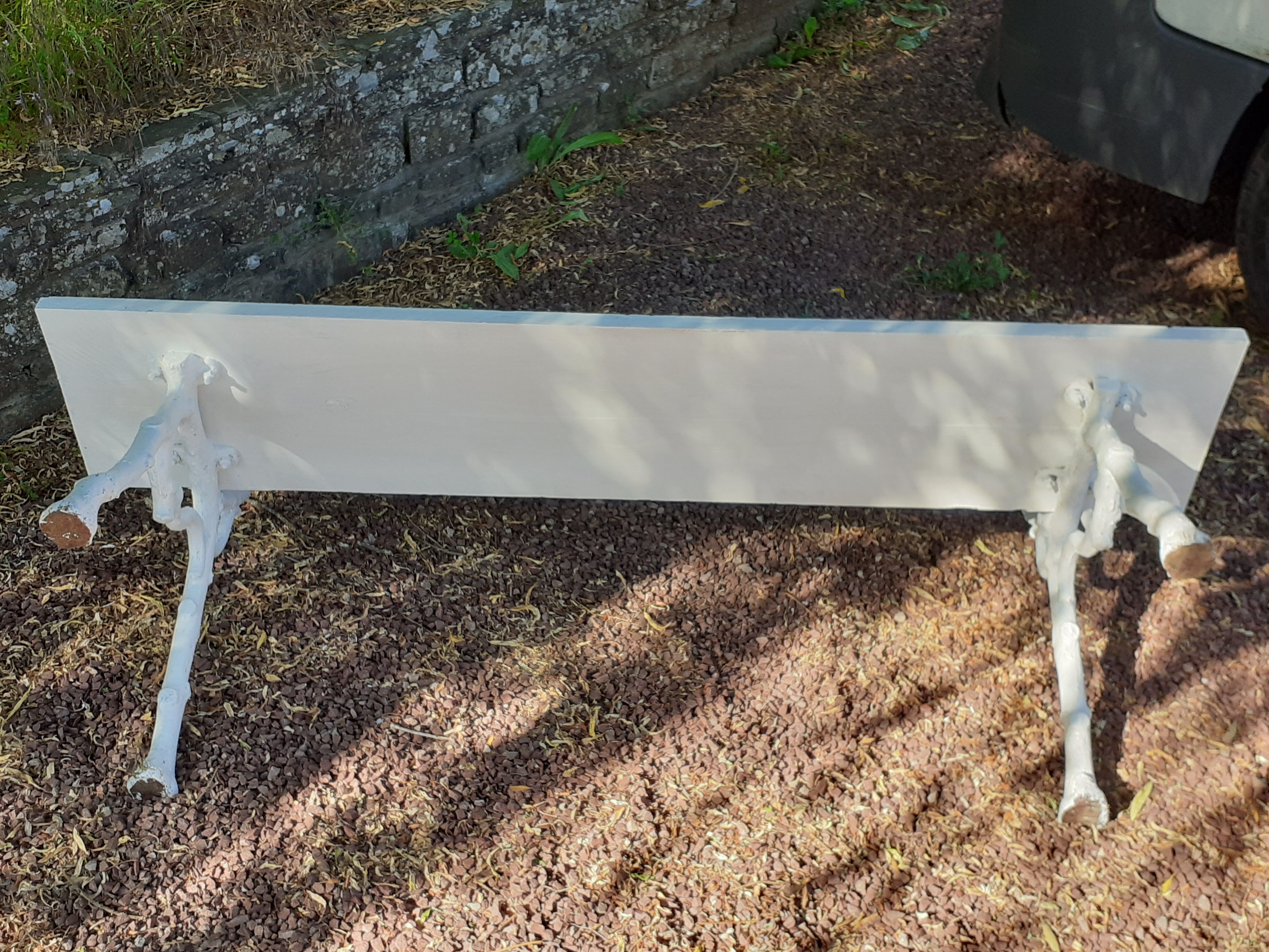 Old garden bench with cast iron feet and wooden planks