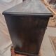 Black patinated chest of drawers