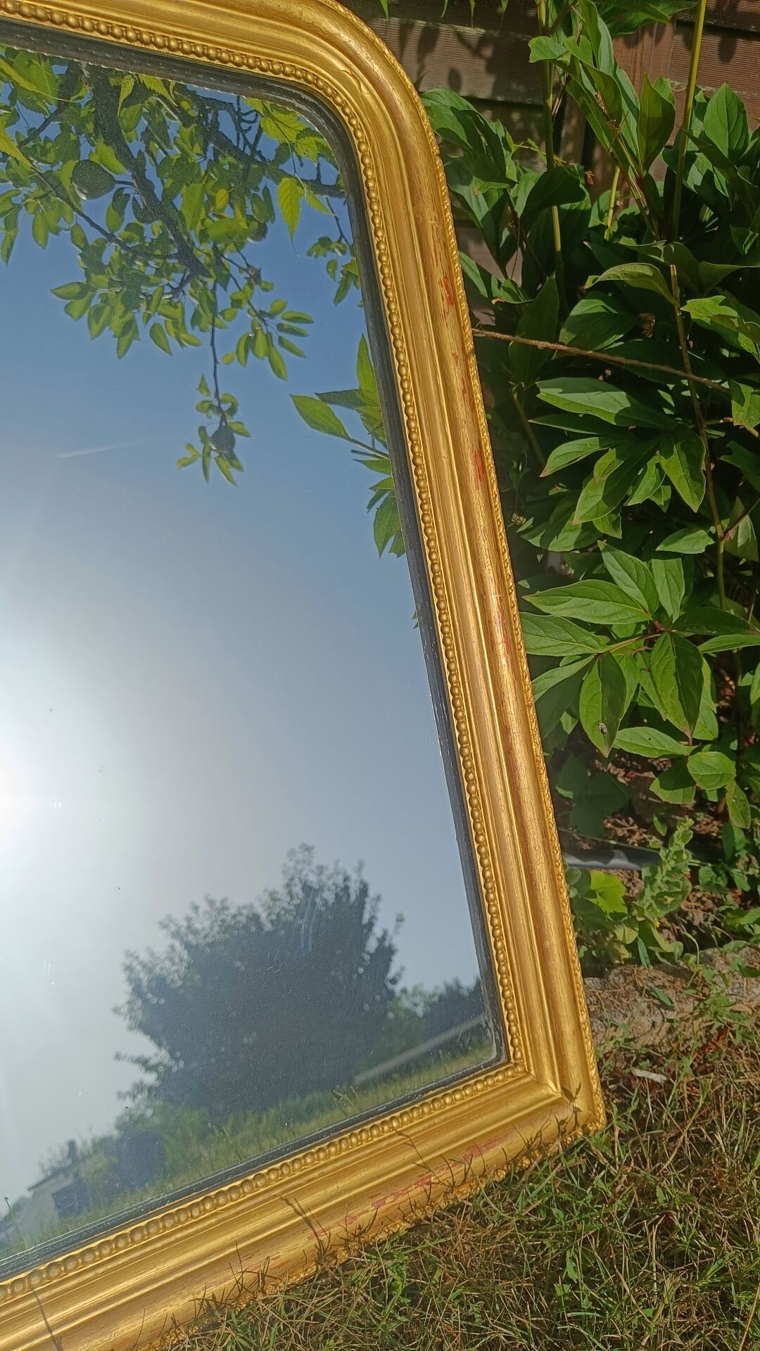 Antique gilded patinated Louis-Philippe mirror