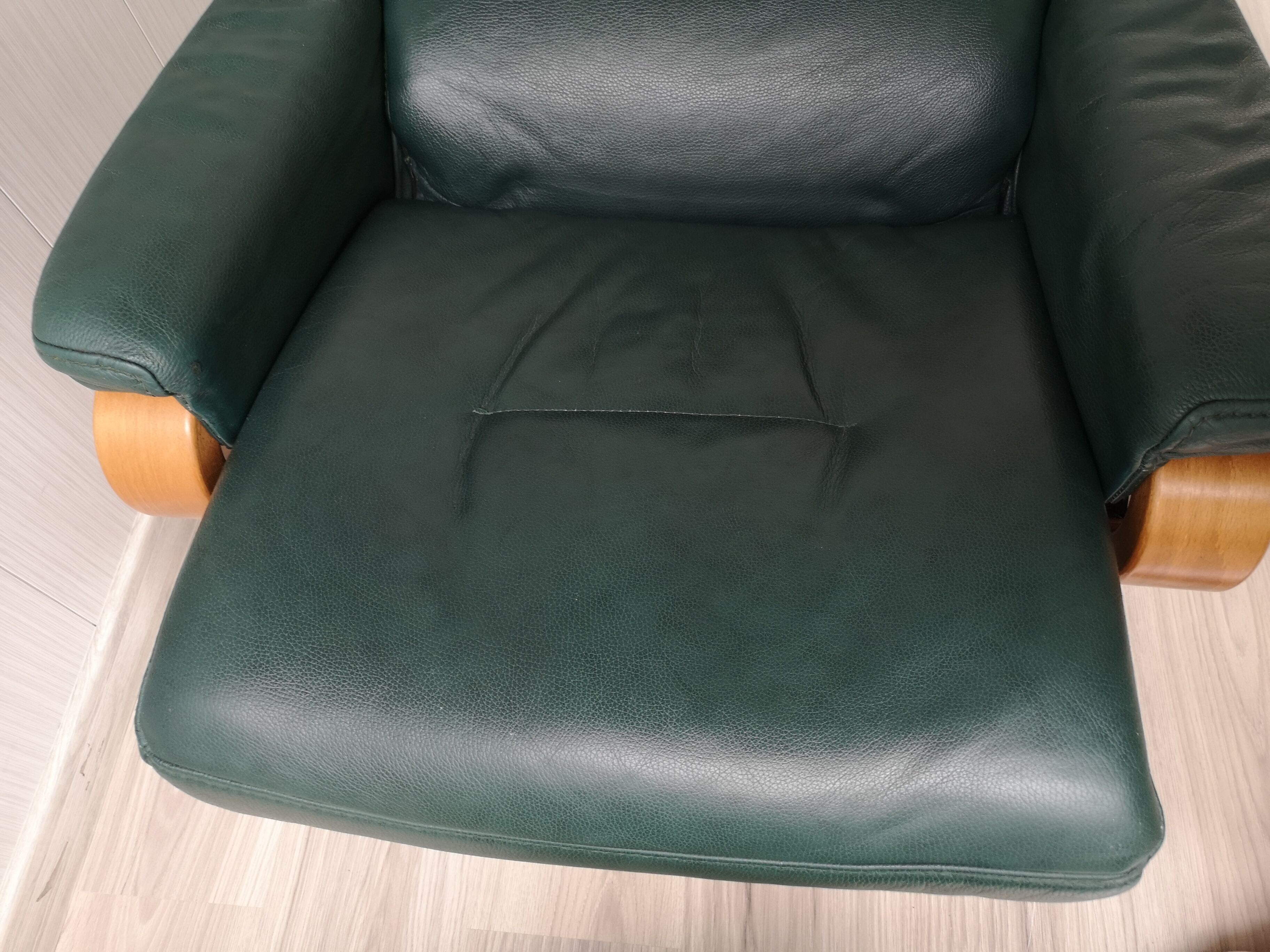 Mid - century leather armchair with footrest with relax function from himolla