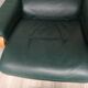 Mid - century leather armchair with footrest with relax function from himolla