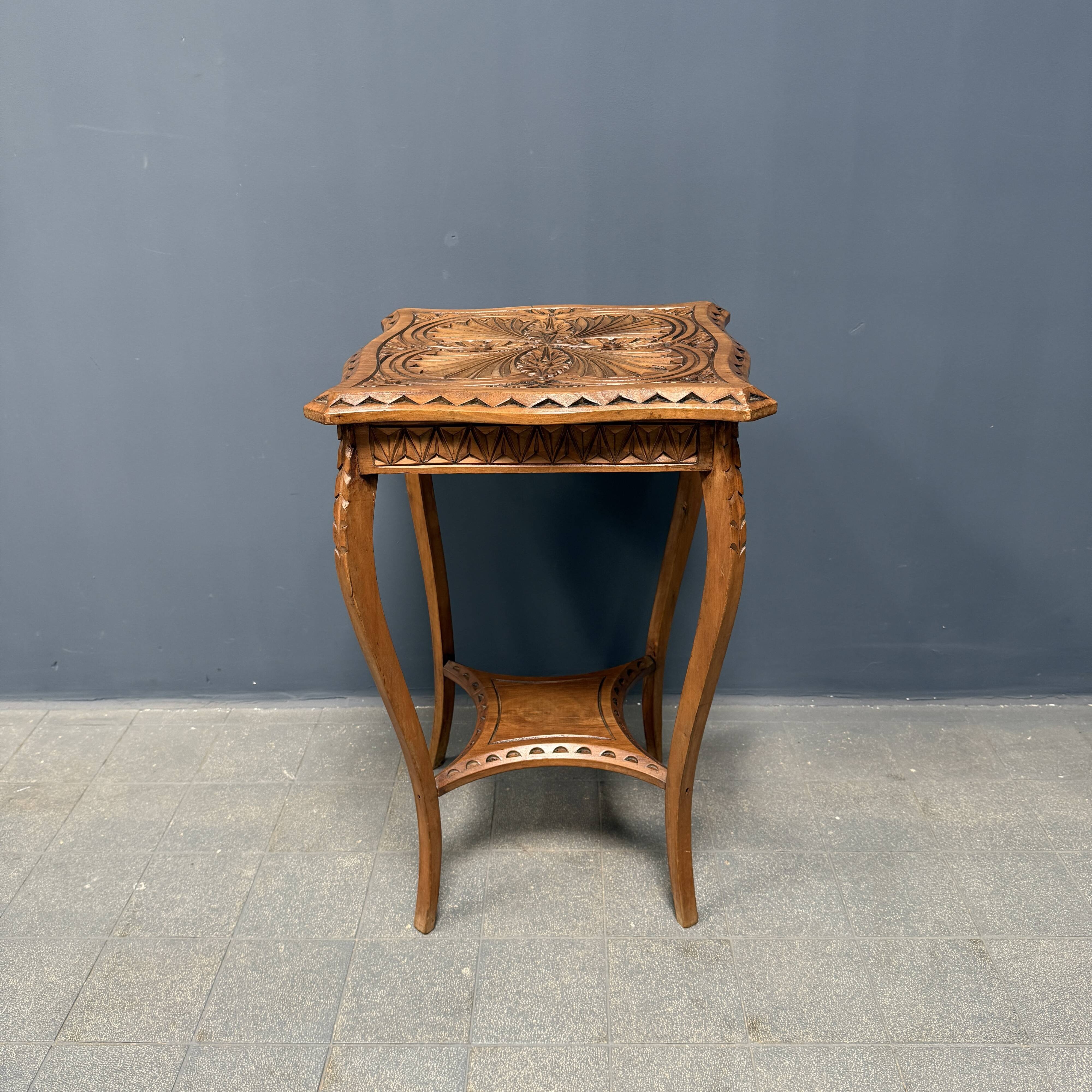 Graceful antique carved wooden side table