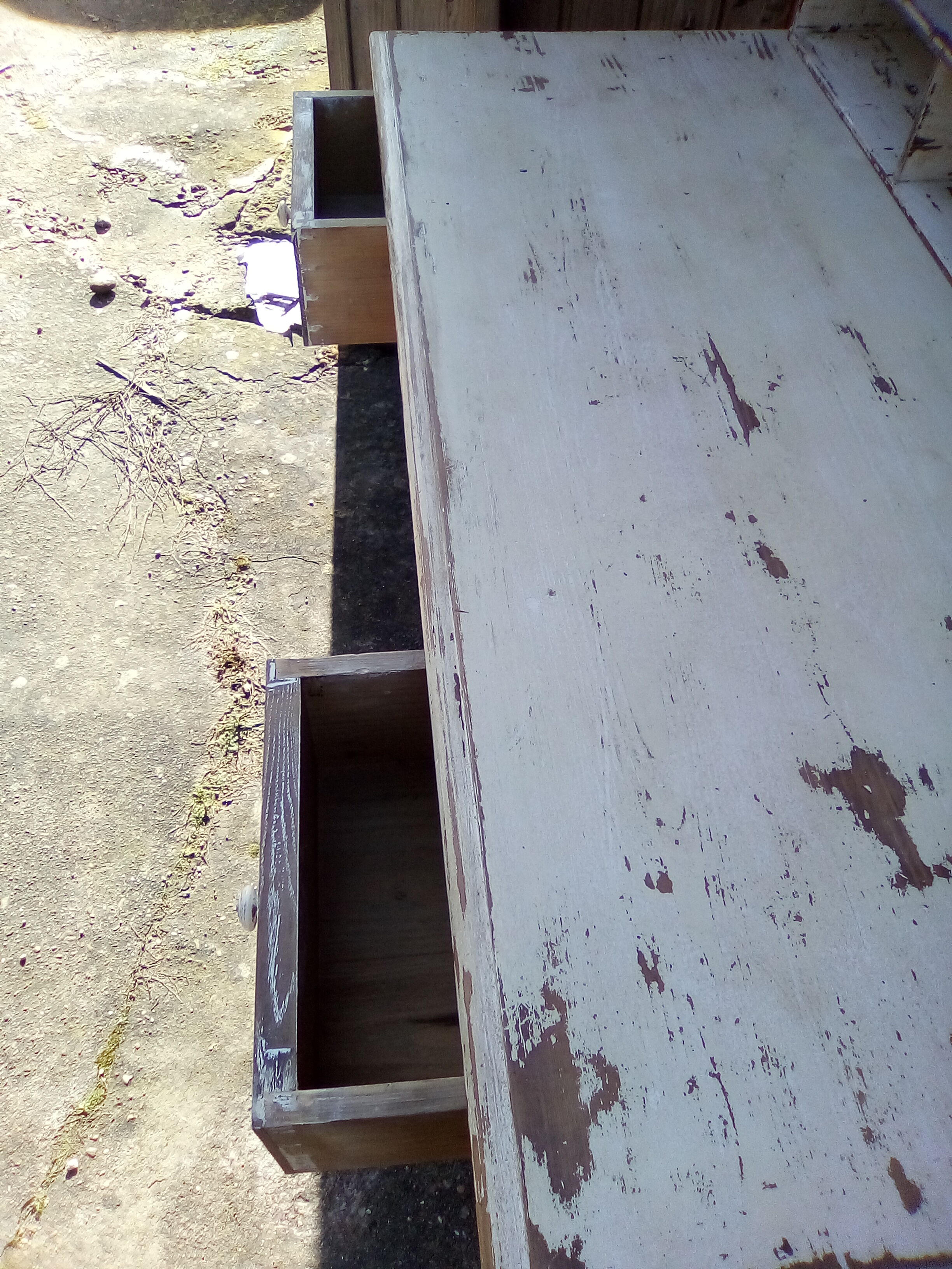 Large wooden desk with patinated bleacher