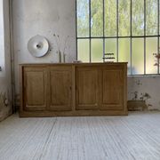 Large row of solid oak loom sliding doors
