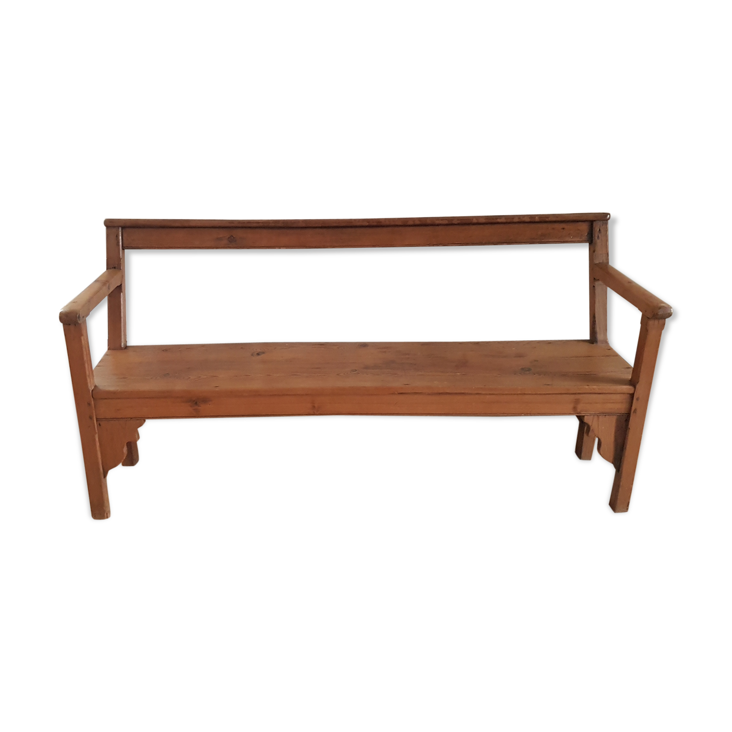 Church bench in fir tree with armrests