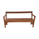 Church bench in fir tree with armrests