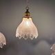 Trio of Art Deco scalloped clear glass pendant lights, 1920-30