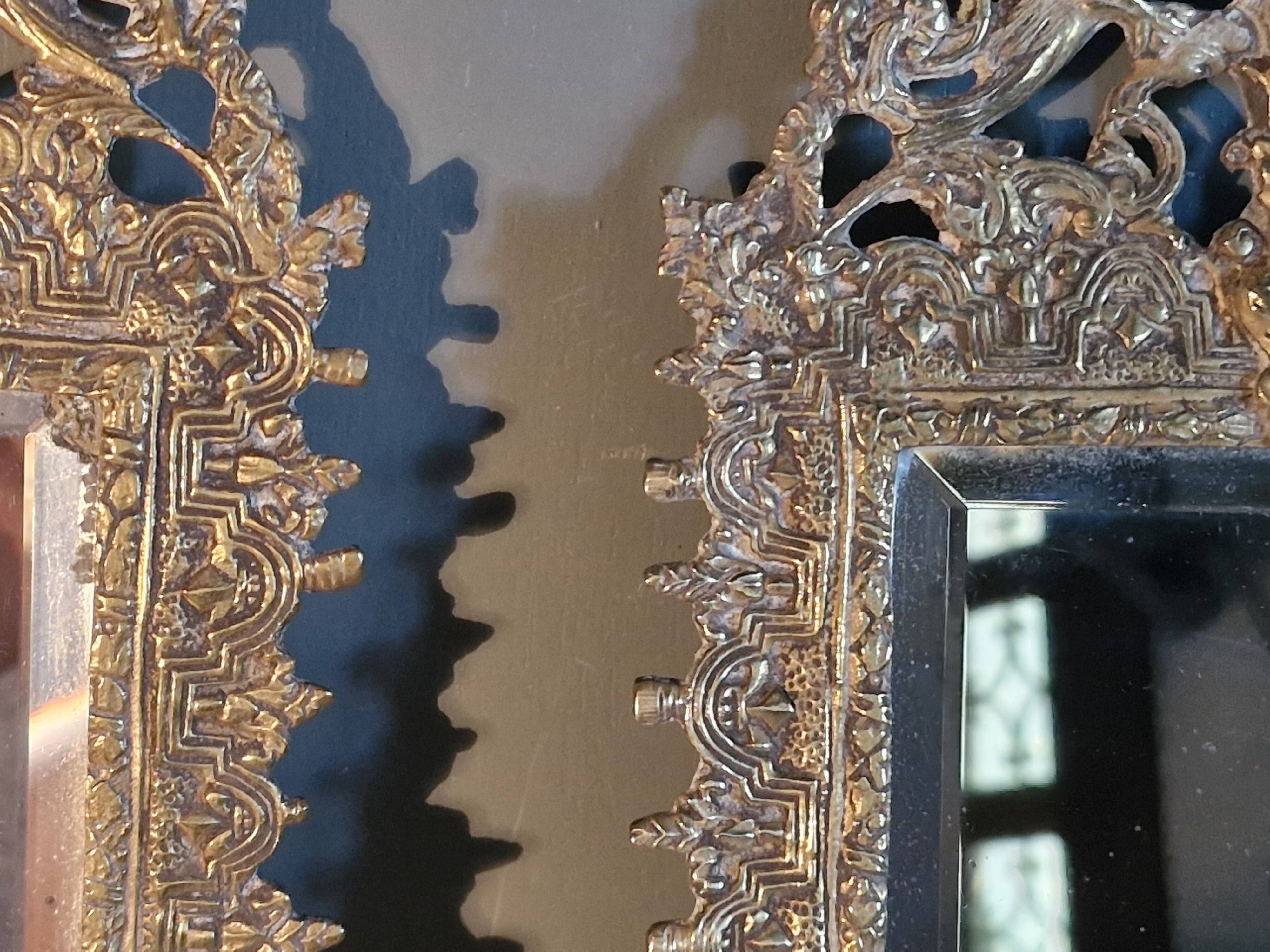 Pair of mirror sconces/candle holders in 19th-century bronze.